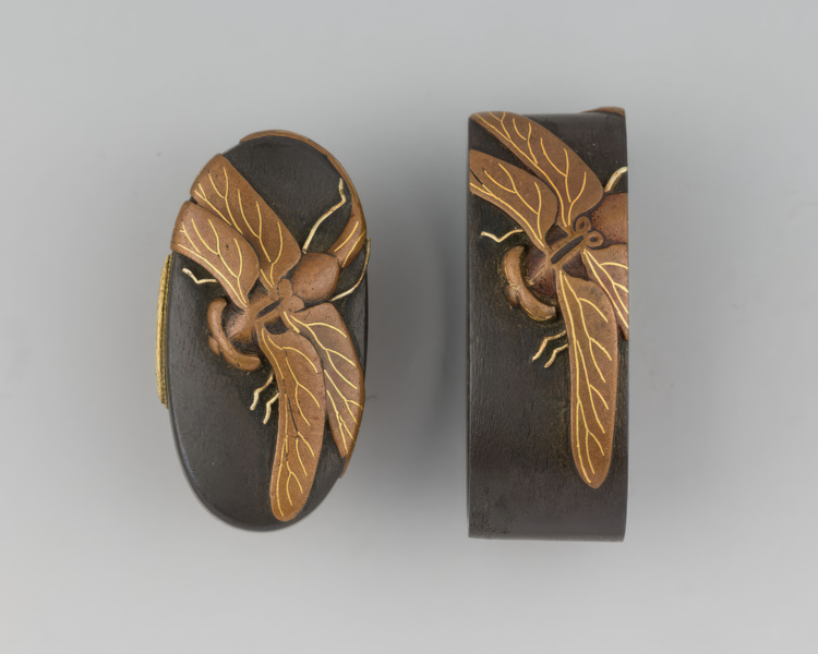 Matching sword fittings comprising the fuchi and kashira