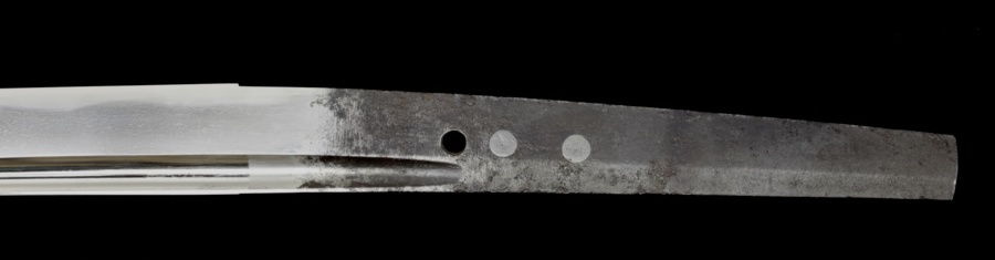 The tang of a blade featuring the end of the groove